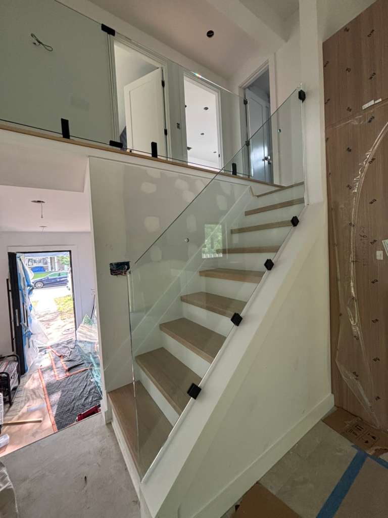 Glass panel railing on staircase — WB Elite Glass project