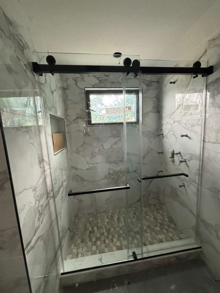 Frameless shower door enclosure installed by WB Elite Glass